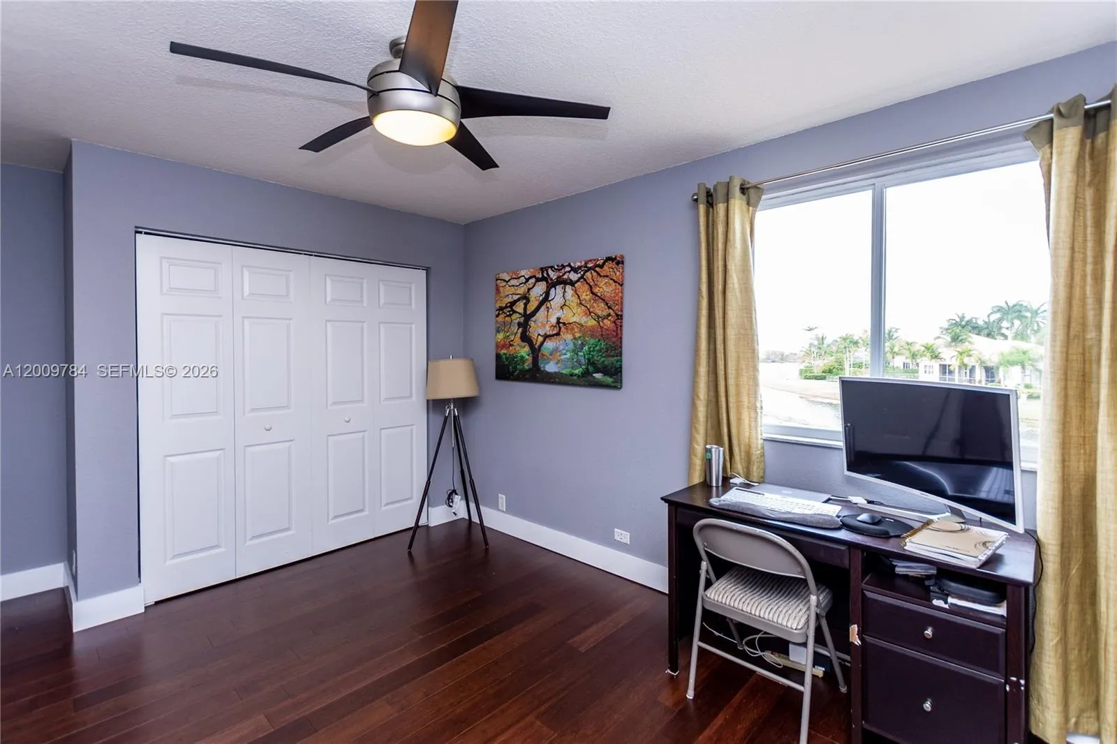 Beautiful 2nd floor bedroom with real wood dark floors and lake view.