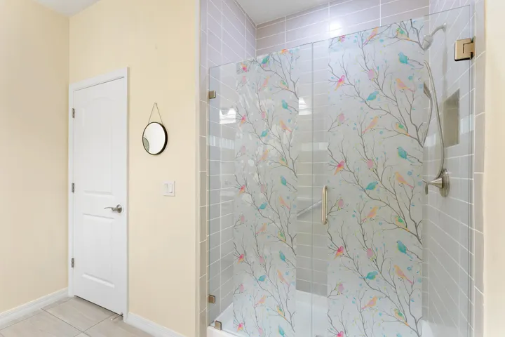 main suite stylish walk-in shower with stand-alone toilet room