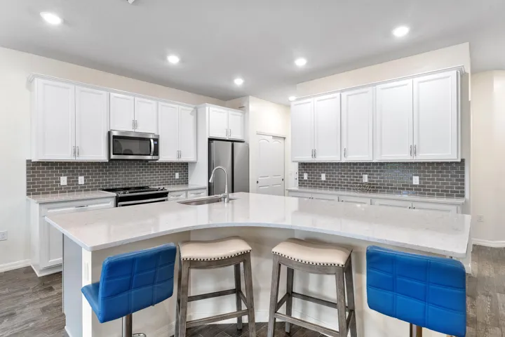 With a glass in your hand, you're now checking your kitchen island out.