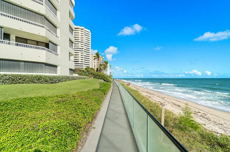 Seawall with walkway and glass railing