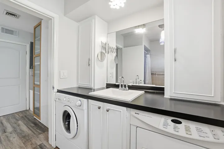 Washer and dryer are in the bathroom
