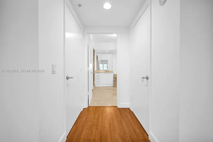Walk to the bathroom with walk-in closet on both sides