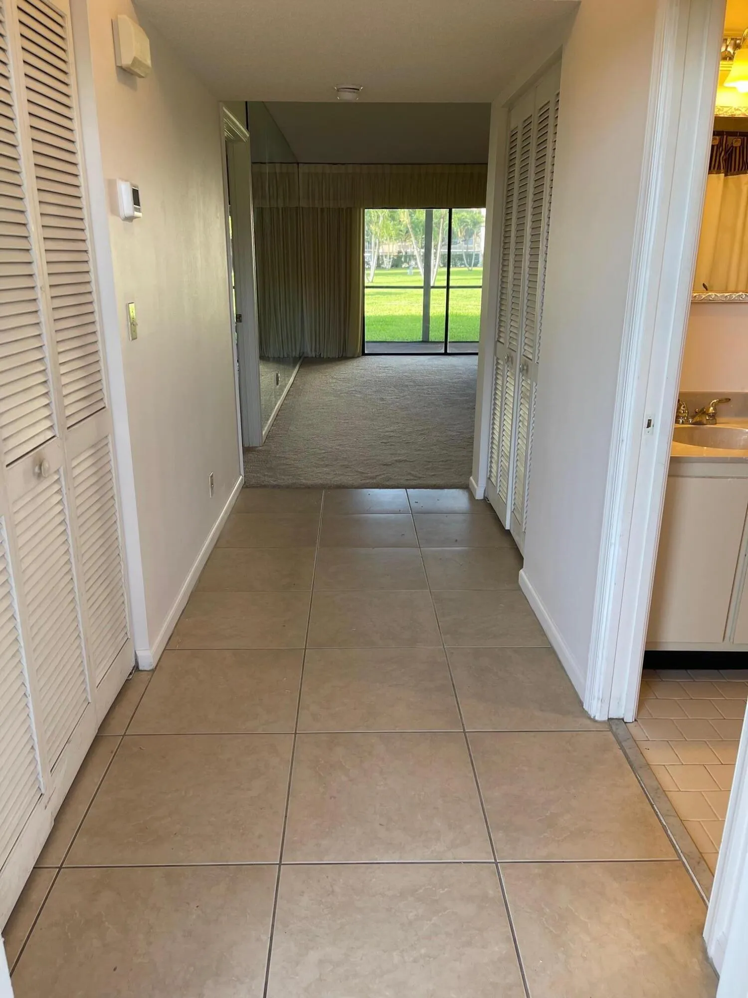 LONG HALLWAY 11.7 X 4.6 WITH 2 CLOSETS