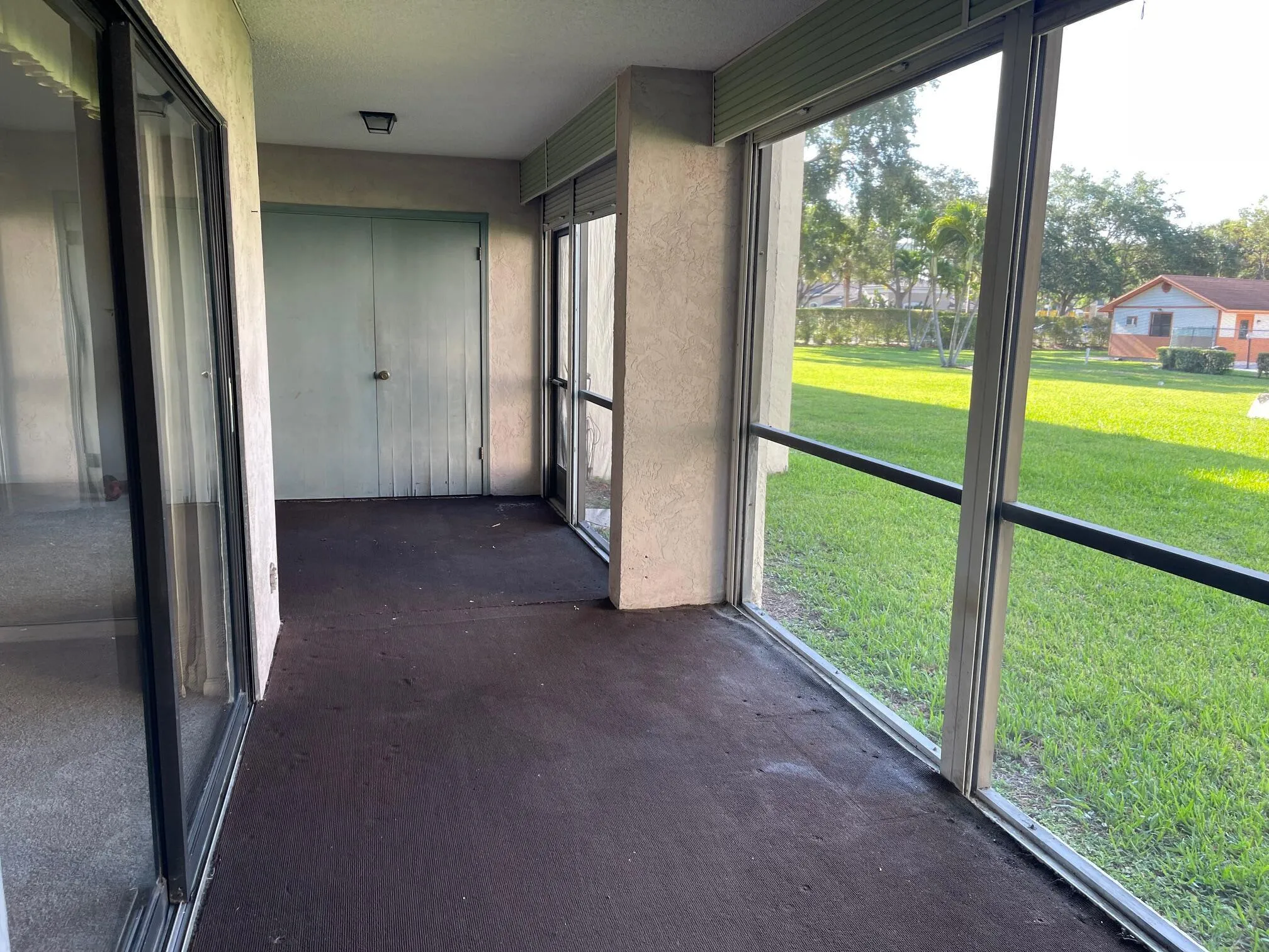 HAS PULL DOWN SHUTTERS AT SCREEN AREA, MASTER, LIVING AND KITCHEN ALL OPEN TO PORCH