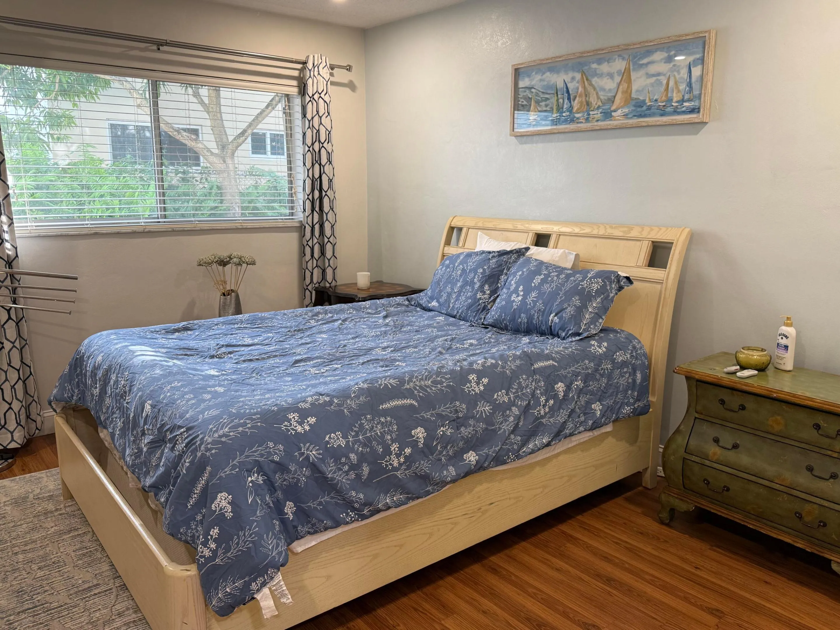 Spacious bedroom with windows and back door to back patio