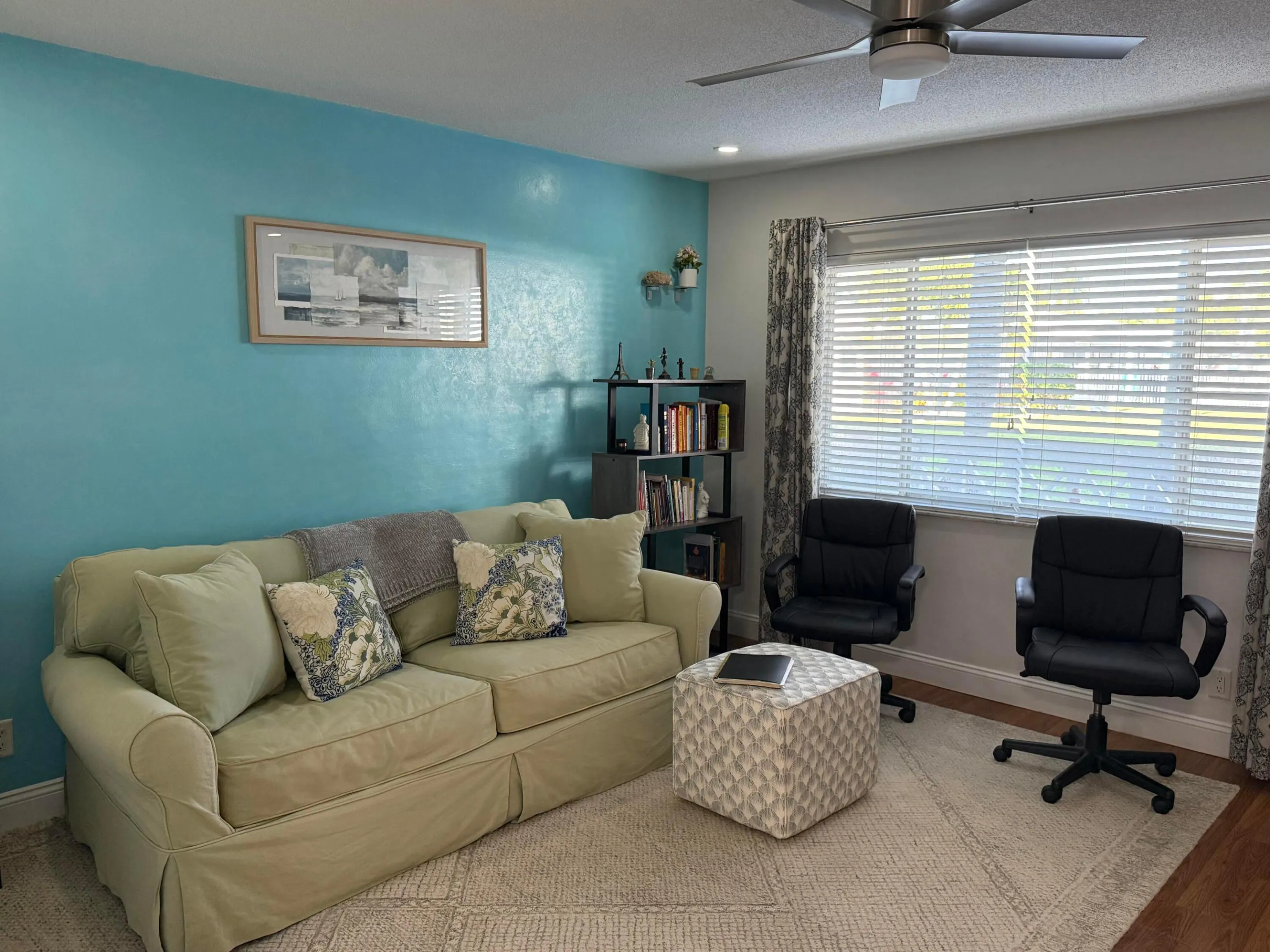 Entry and living room with view of the garden & pool area