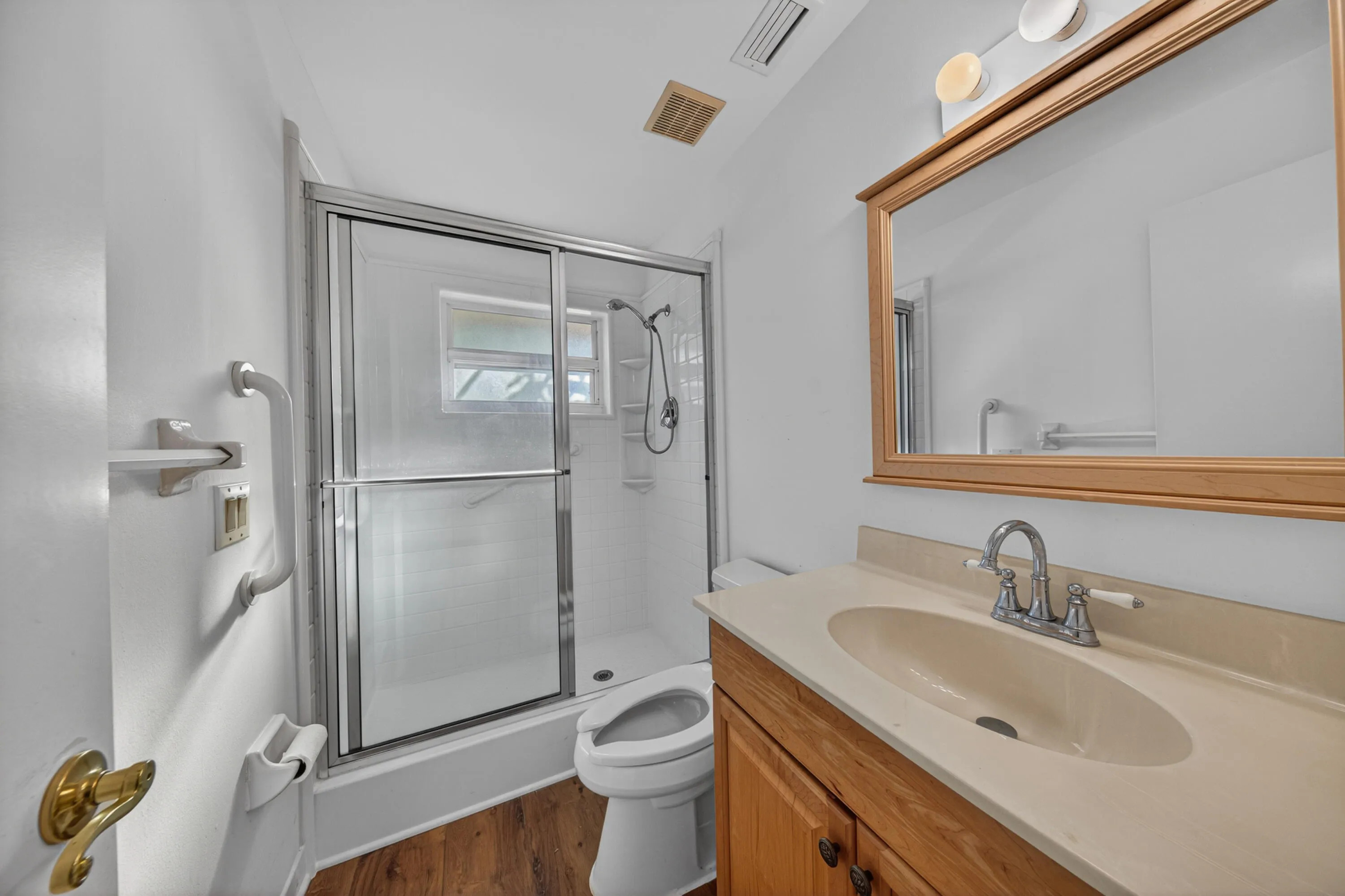 Second Bathroom: Located in the hallway for guest and bedroom access.
