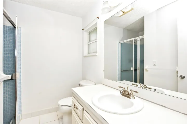 Updated master bath with enclosed glass shower.