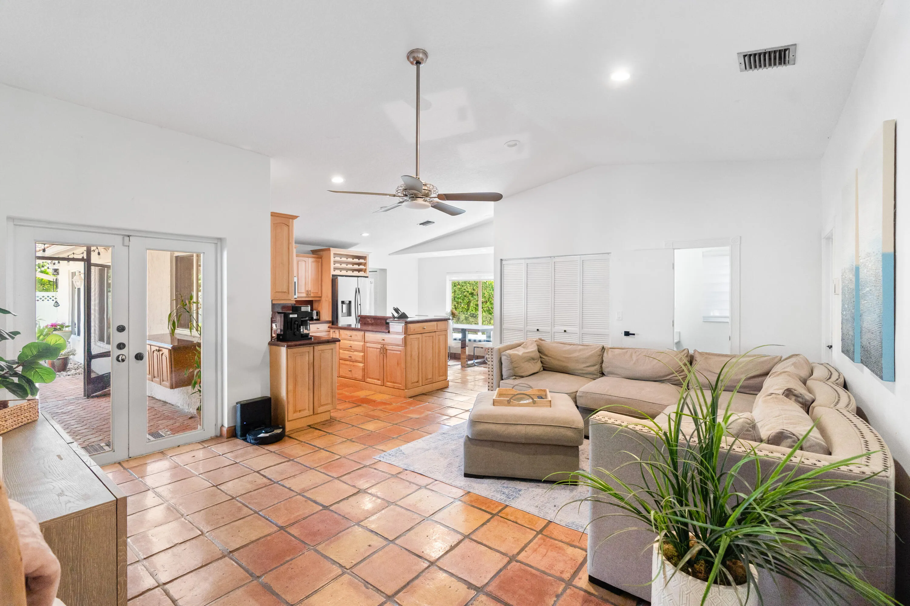 Family room open to kitchen and dining area. All French doors and windows here are PGT Impact windows
