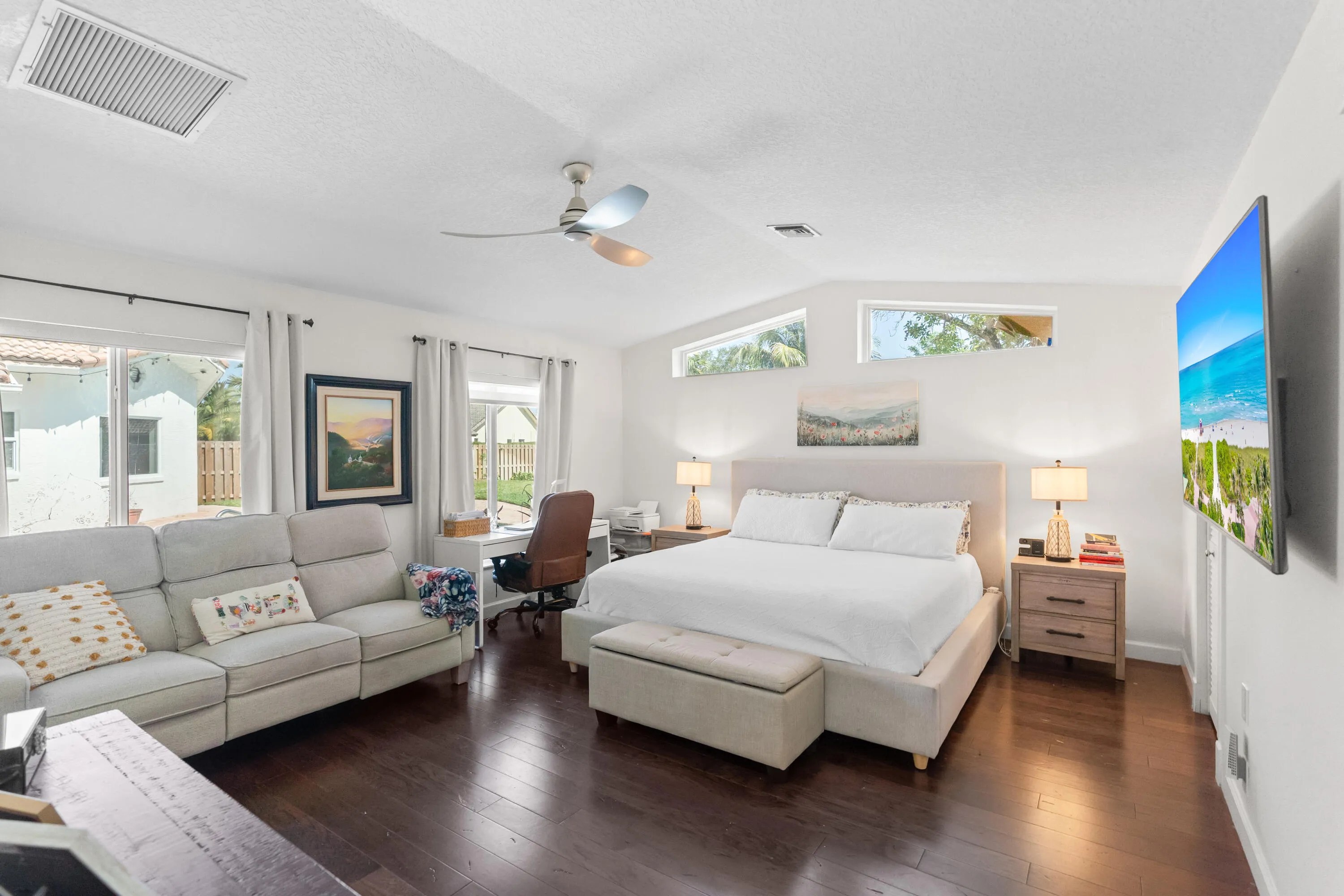 Second en-suite featuring a walk-in closet with custom built-ins and a private en-suite bathroom.