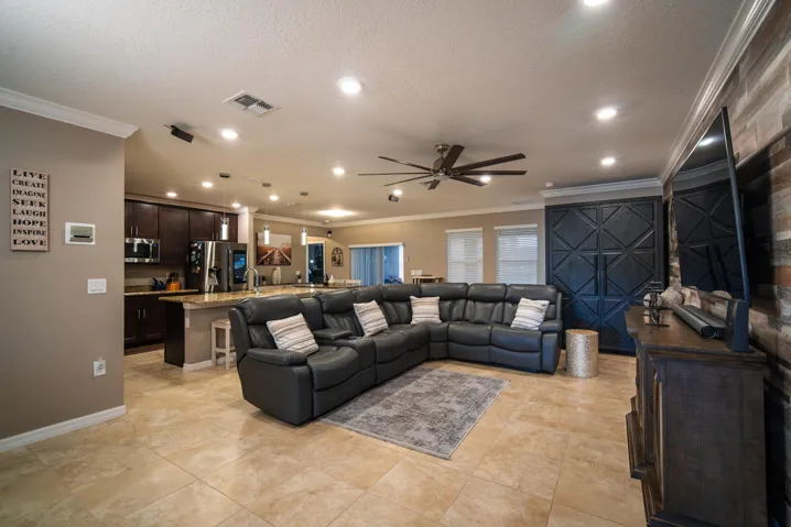 Bright, open living space with full home tile and modern flow