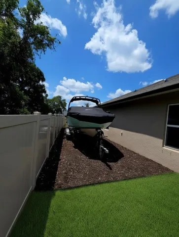 Boat/RV parking behind the fence — no HOA restrictions