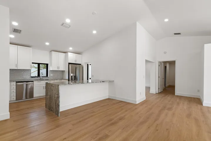 Vaulted Ceiling with Recessed Lighting.