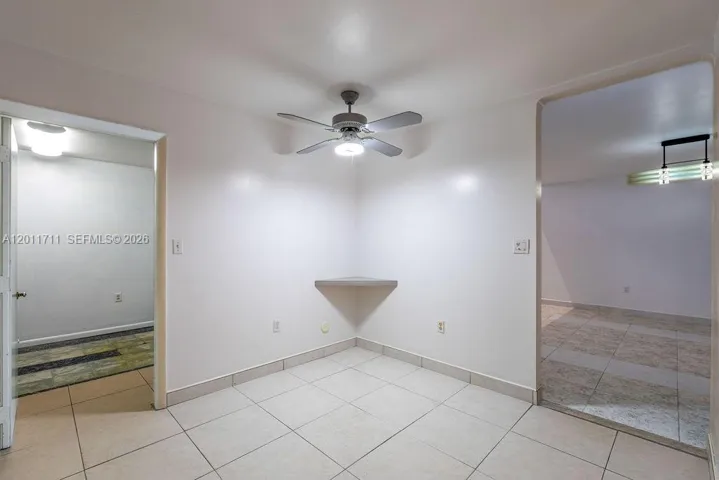 Kitchen looking to living room and garage