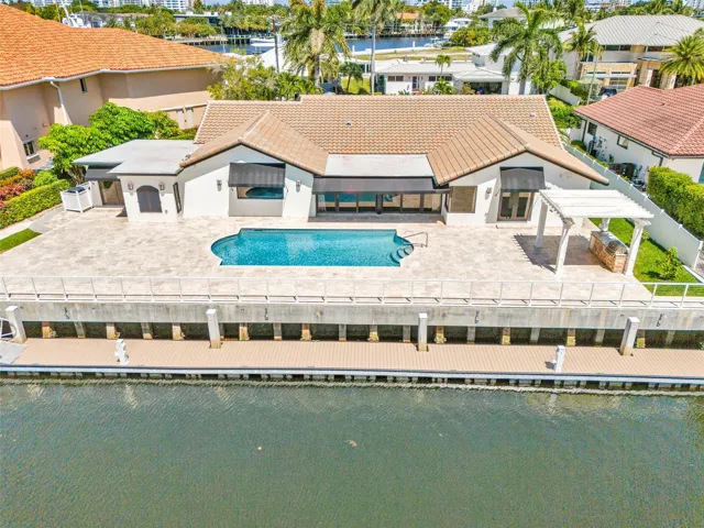 Rear Exposure of the residence showing the 120' of protected dockage with unrestricted saltwater ocean & Intracoastal access with no fixed bridges
