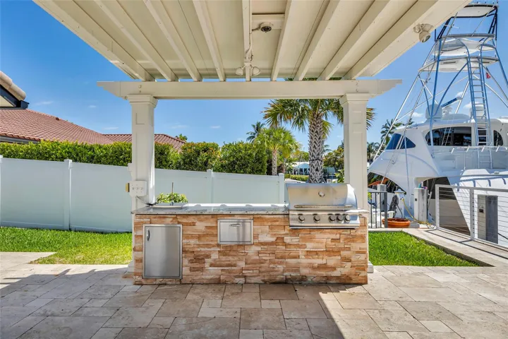 Backyard pergola with grilling area
