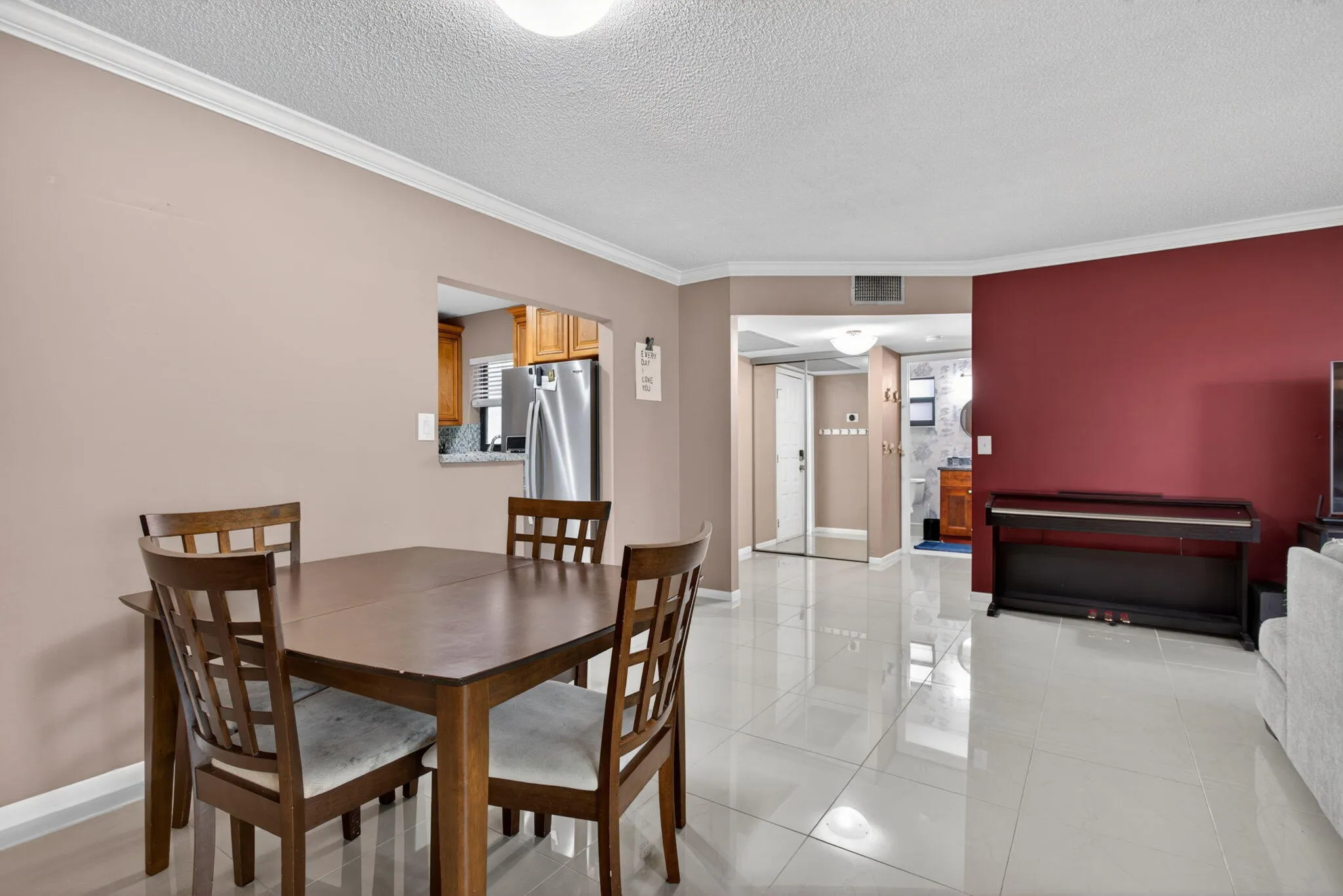 The unit has a lot of natural light from the floor to ceiling impacted windows. The unit has beautiful porcelain tile that runs throughout the living, dining and kitchen.
