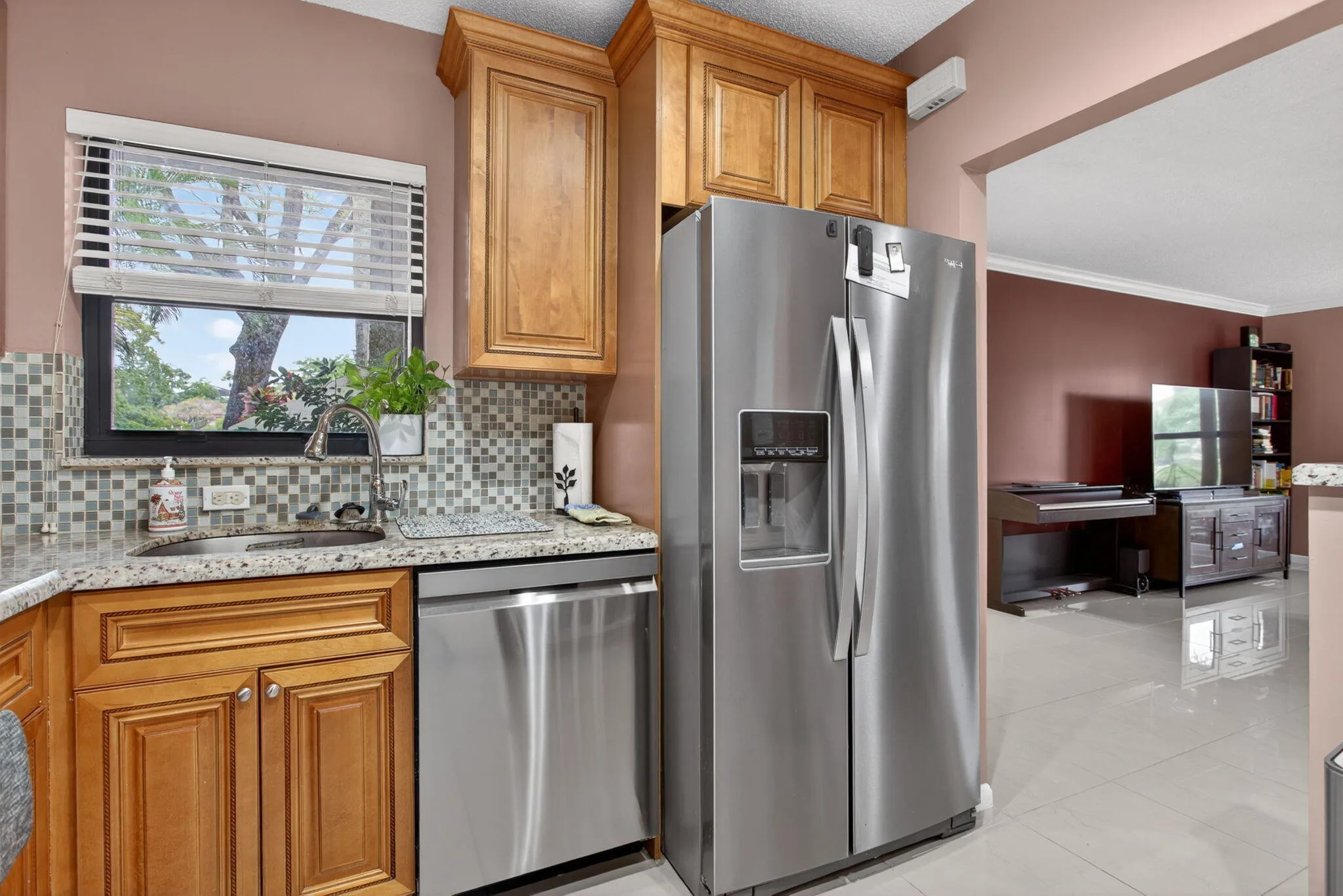The kitchen is tastefully updated with new stainless steal appliances and custom cabinets.