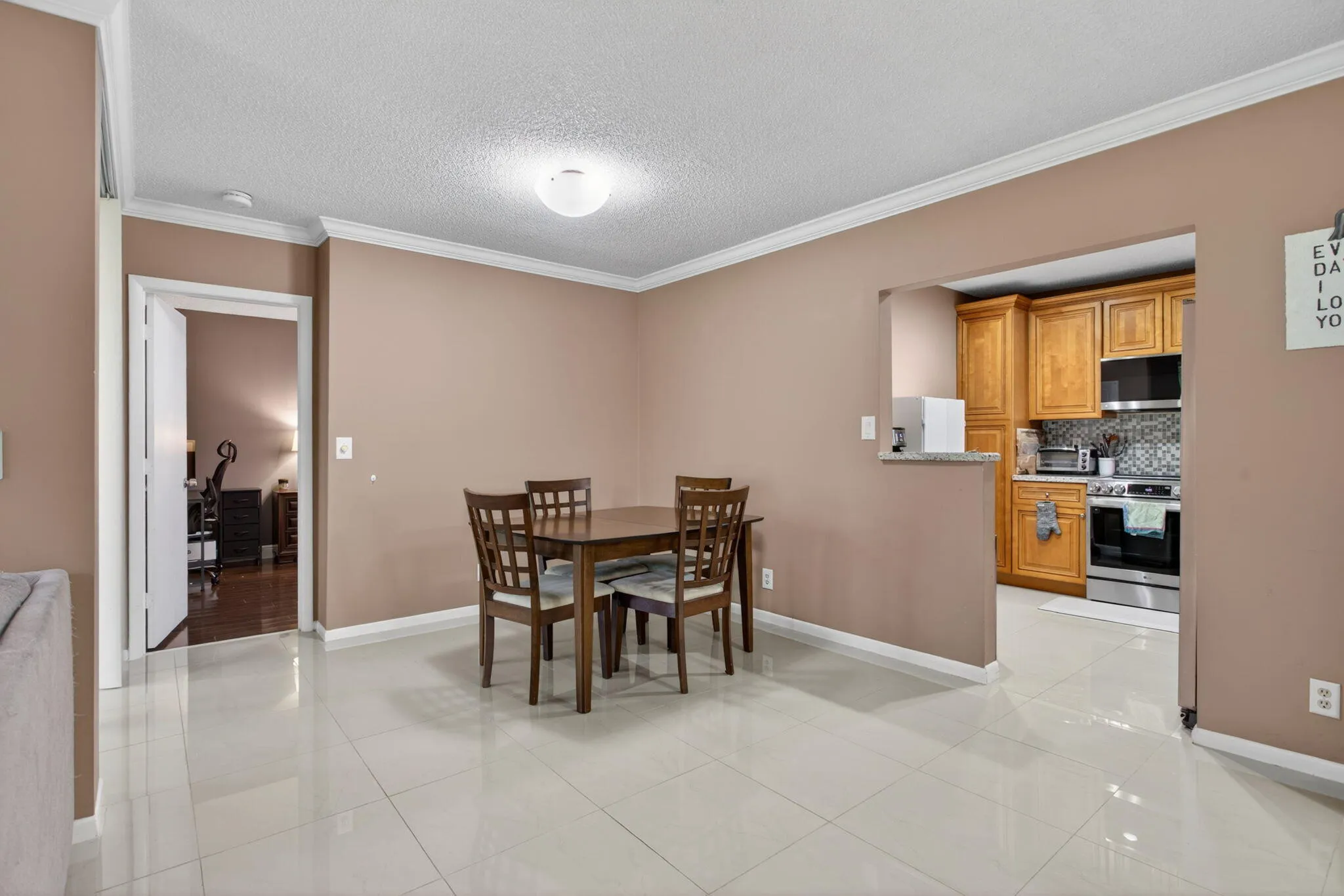 The kitchen is tastefully updated with new stainless steal appliances and custom cabinets.