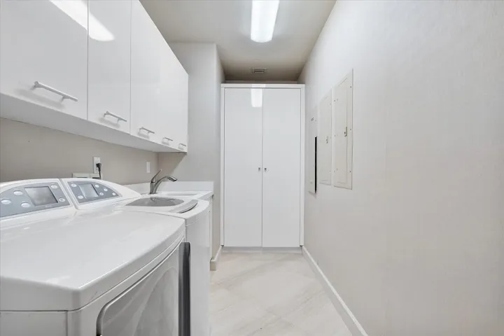 Staff separate area; has a fold-down Murphy bed, a closet, a full en suite bathroom, and is adjacent to the laundry room. This area has a separate entrance into the building hallway as well.