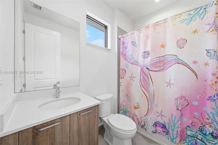 Master Bathroom witj double sink, shower and separate toilet