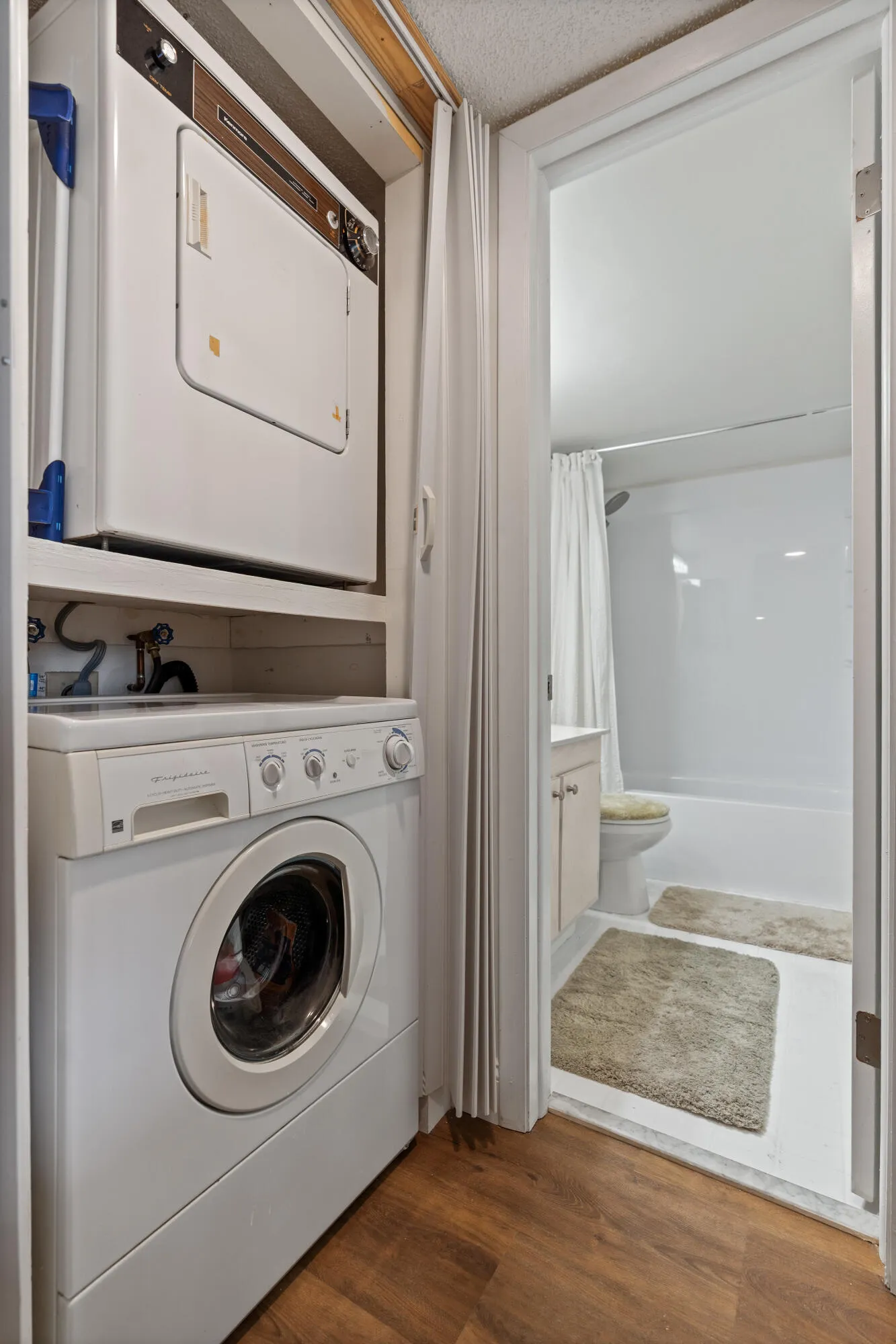 Dryer, washer, and guest bathroom.