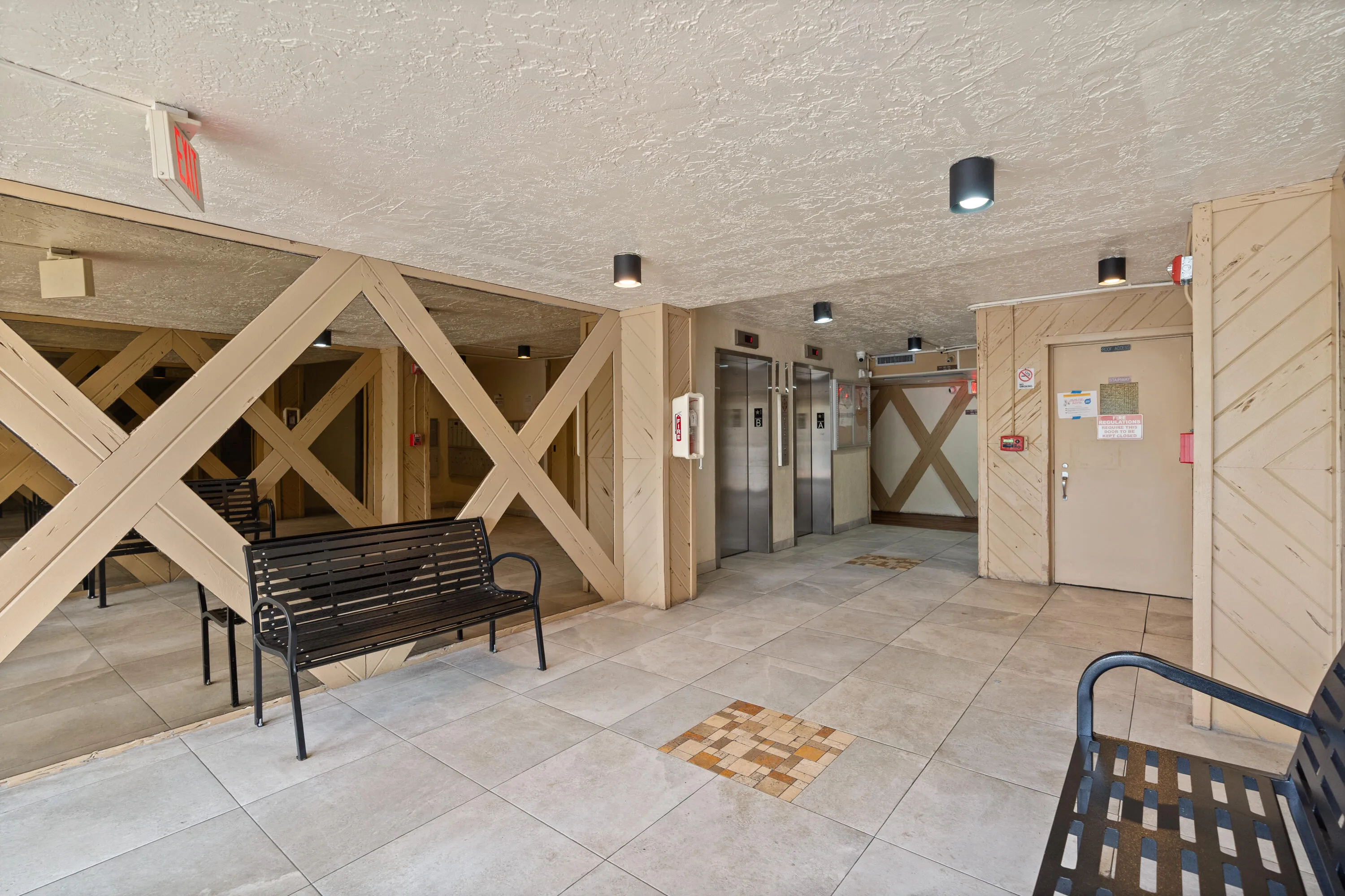 Lobby with two elevators.