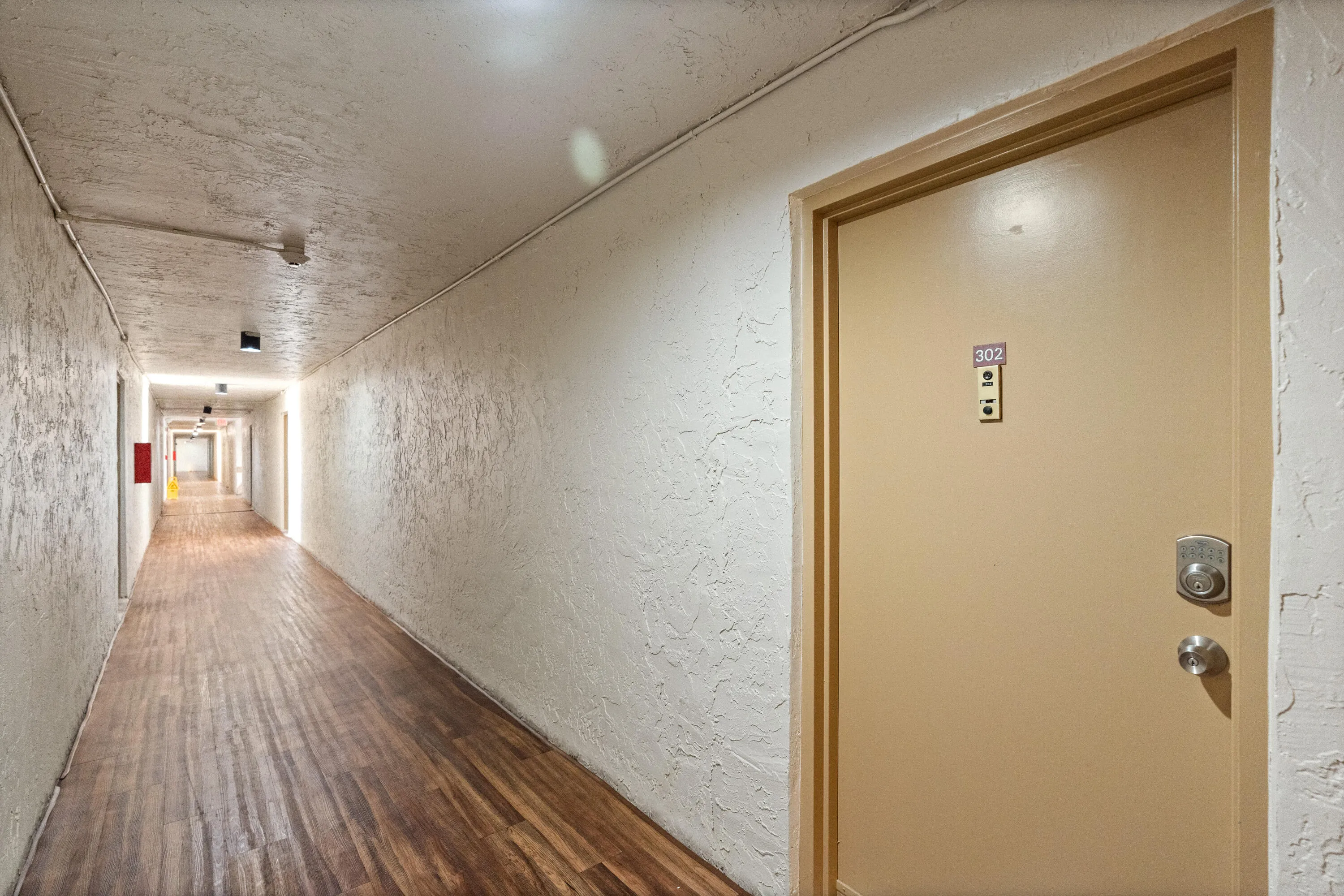 Front door in air conditioned hallway.