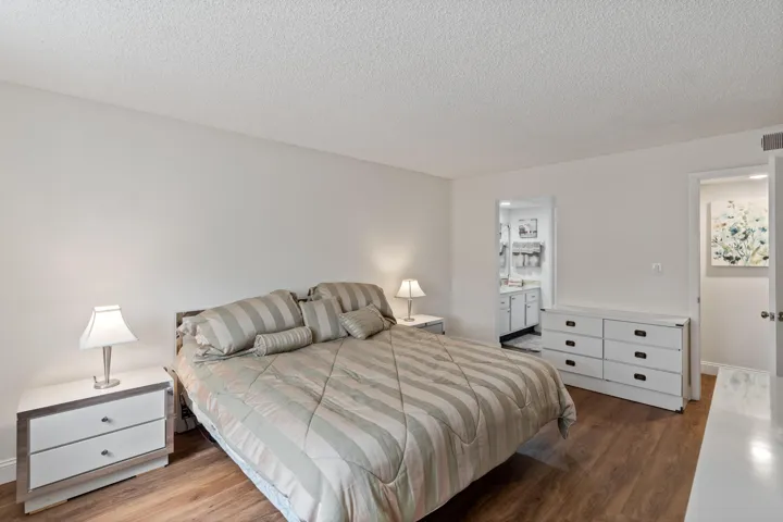 Master bedroom with sink area of master bathroom.