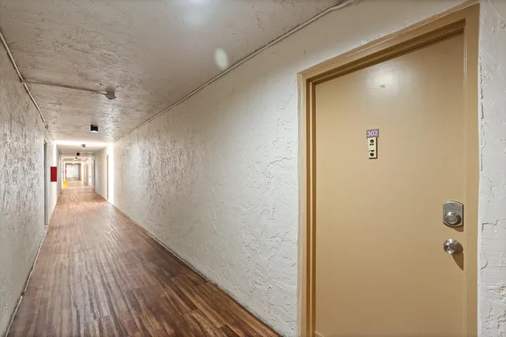 Front door in air conditioned hallway.