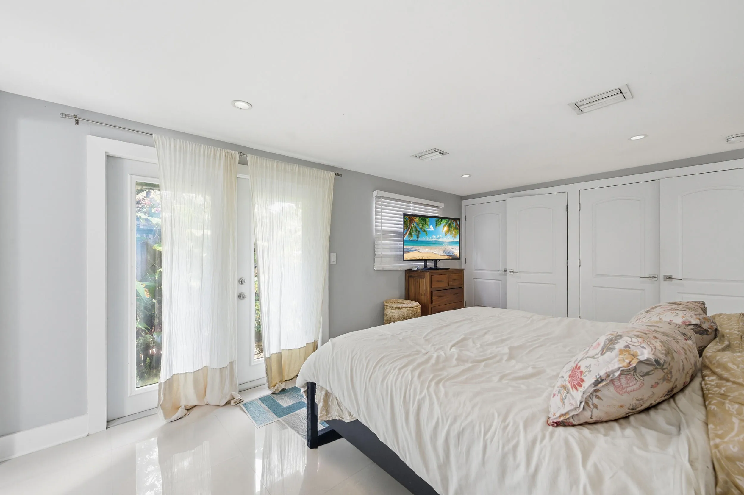 Primary Bedroom with French Doors Leading Out to Garden