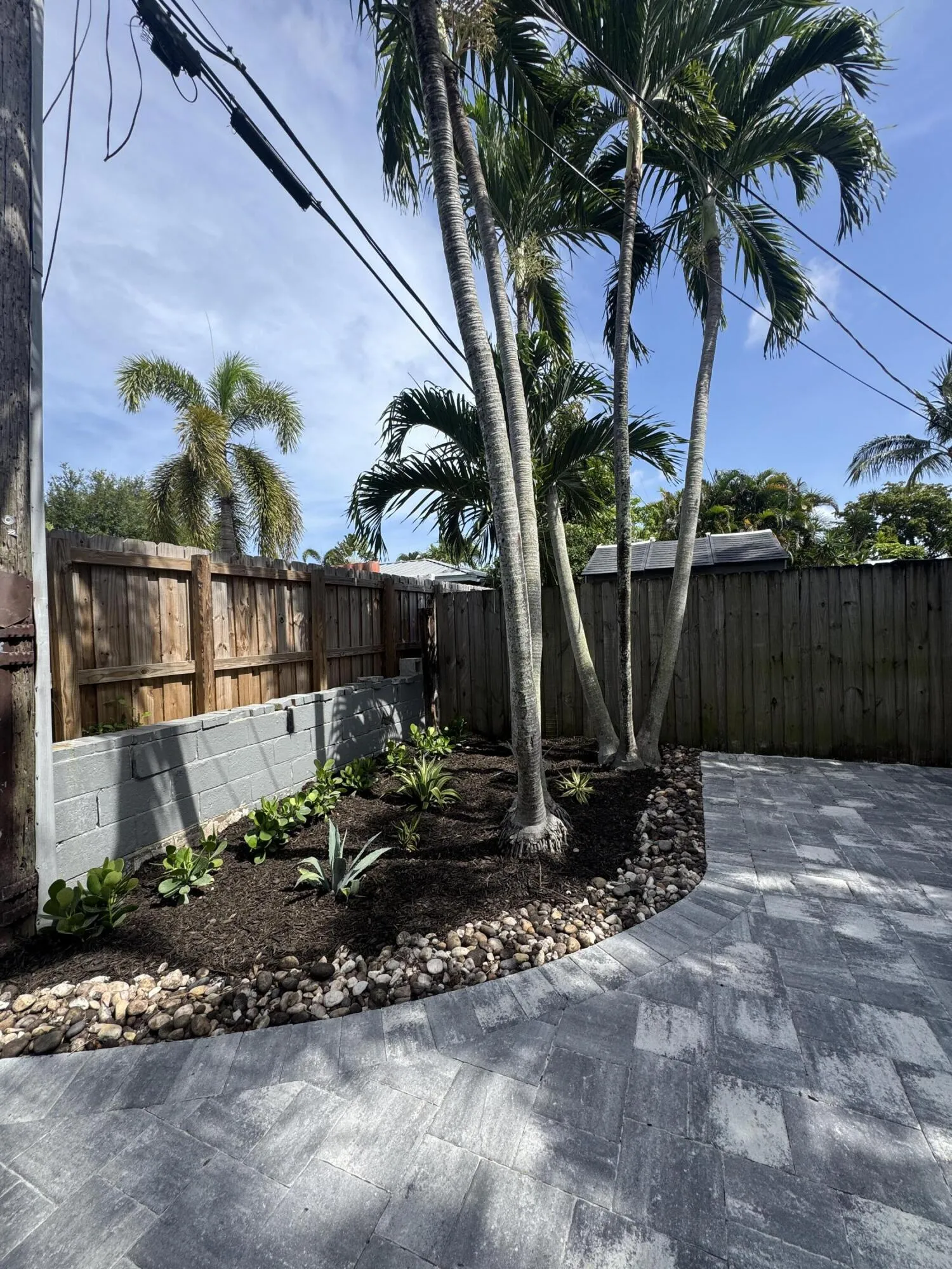 Private fenced in backyard; new pavers and landscaping