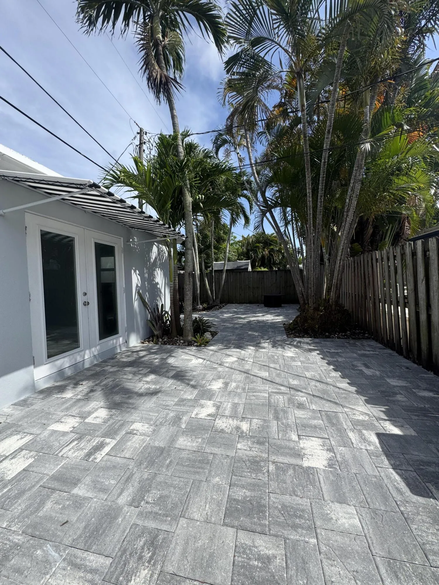 Private fenced in backyard; new pavers and landscaping