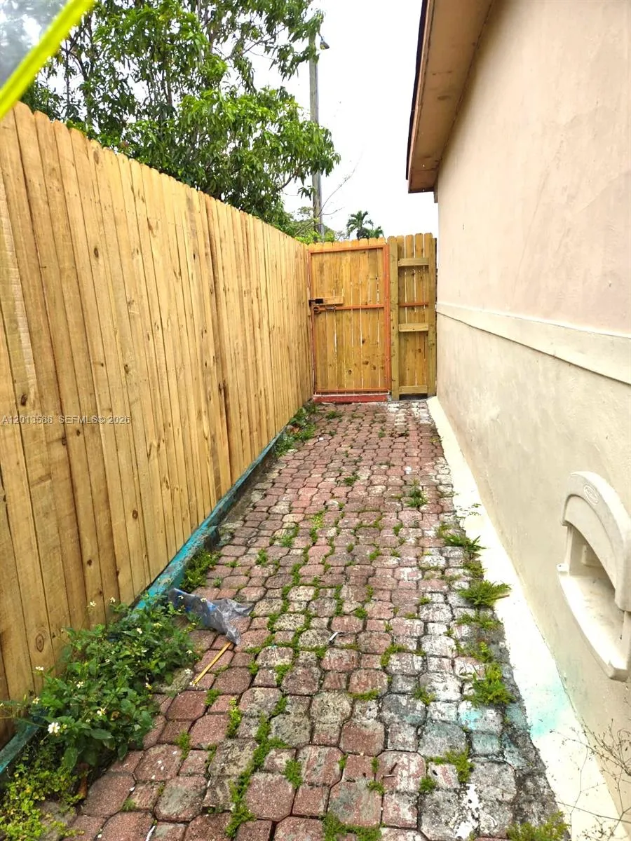 Private, Fenced walkway to front entrance of the unit