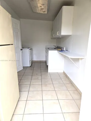 As soon as you enter the unit you are welcomed by the kitchen area.