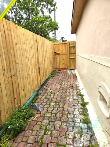 Private, Fenced walkway to front entrance of the unit
