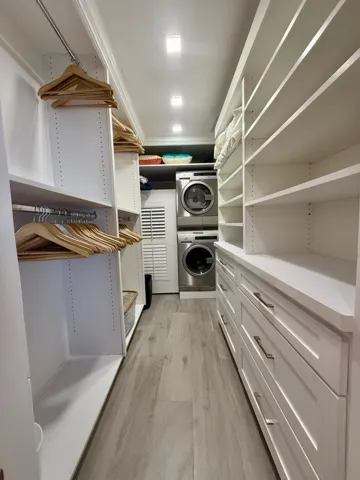 MASTER WALK IN WITH CUSTOM CLOSET SHELVING, WASHER/DRYER