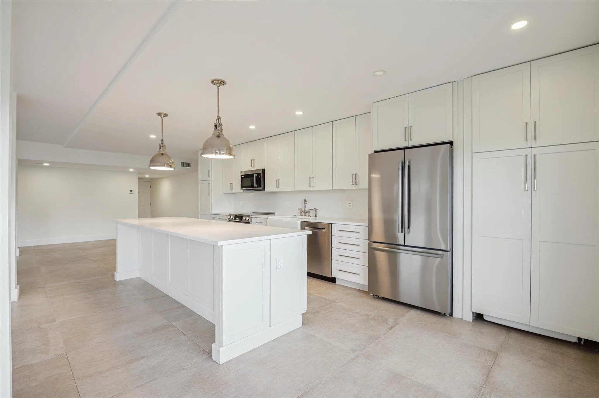 Gourmet-style kitchen with expansive island perfect for casual dining and hosting.