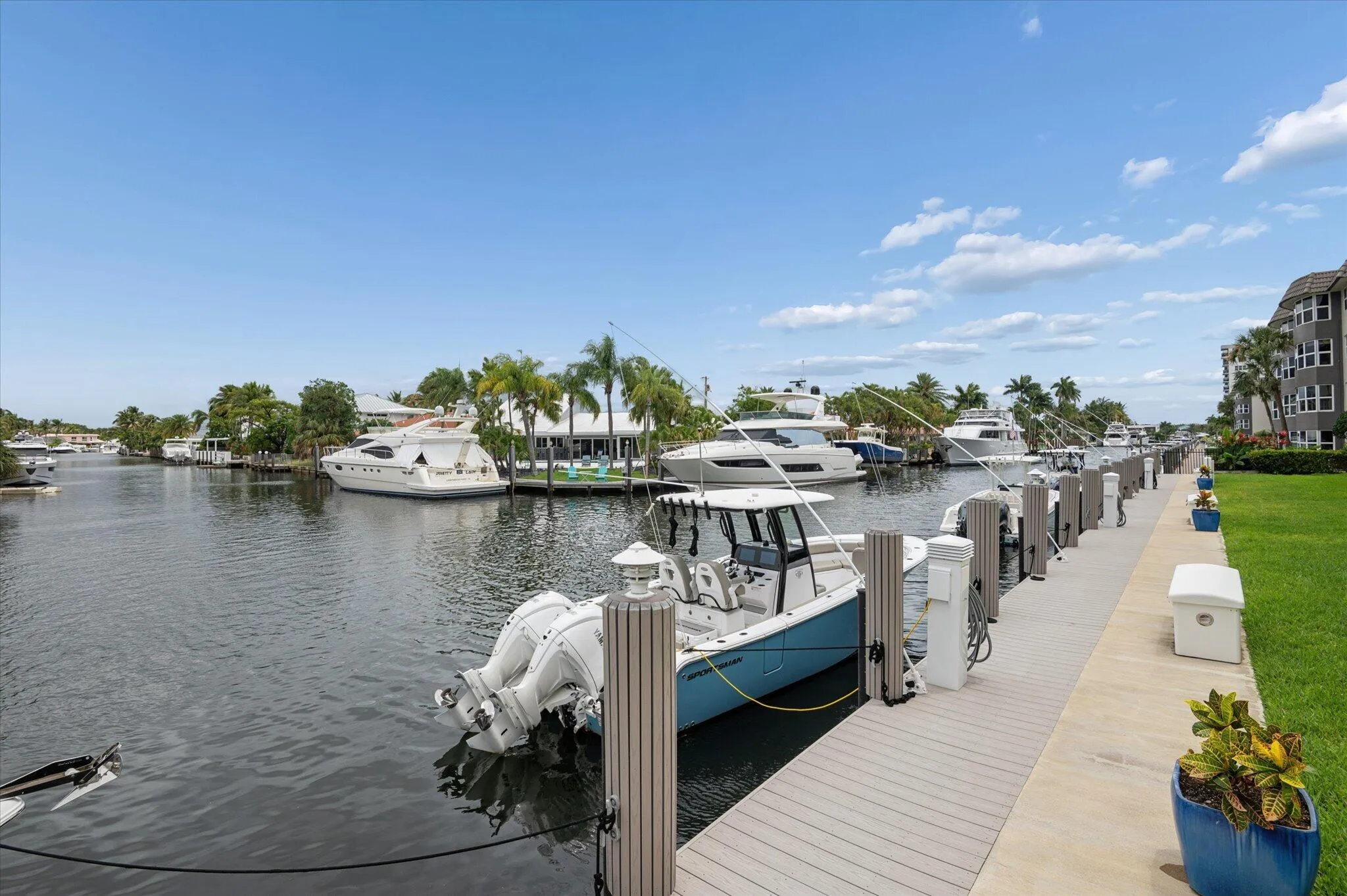 Scenic canal views surrounded by luxury homes and boats, capturing the South Florida lifestyle.