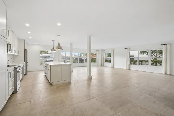 Generous open-concept layout with panoramic water views— 1,835 sq ft of living space provides flexibility for multiple dining, entertaining, or work-from-home configurations.