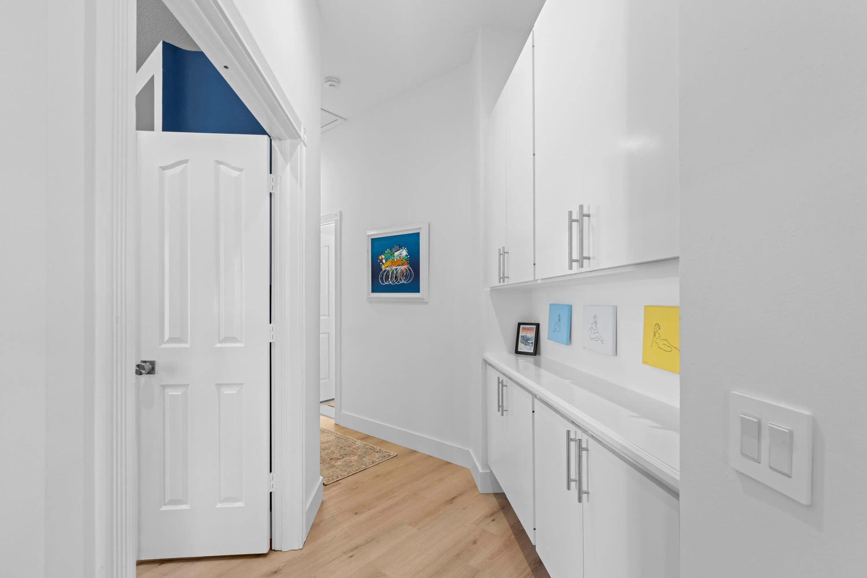 Hallway to Guest Bedrooms & Laundry Room / Garage