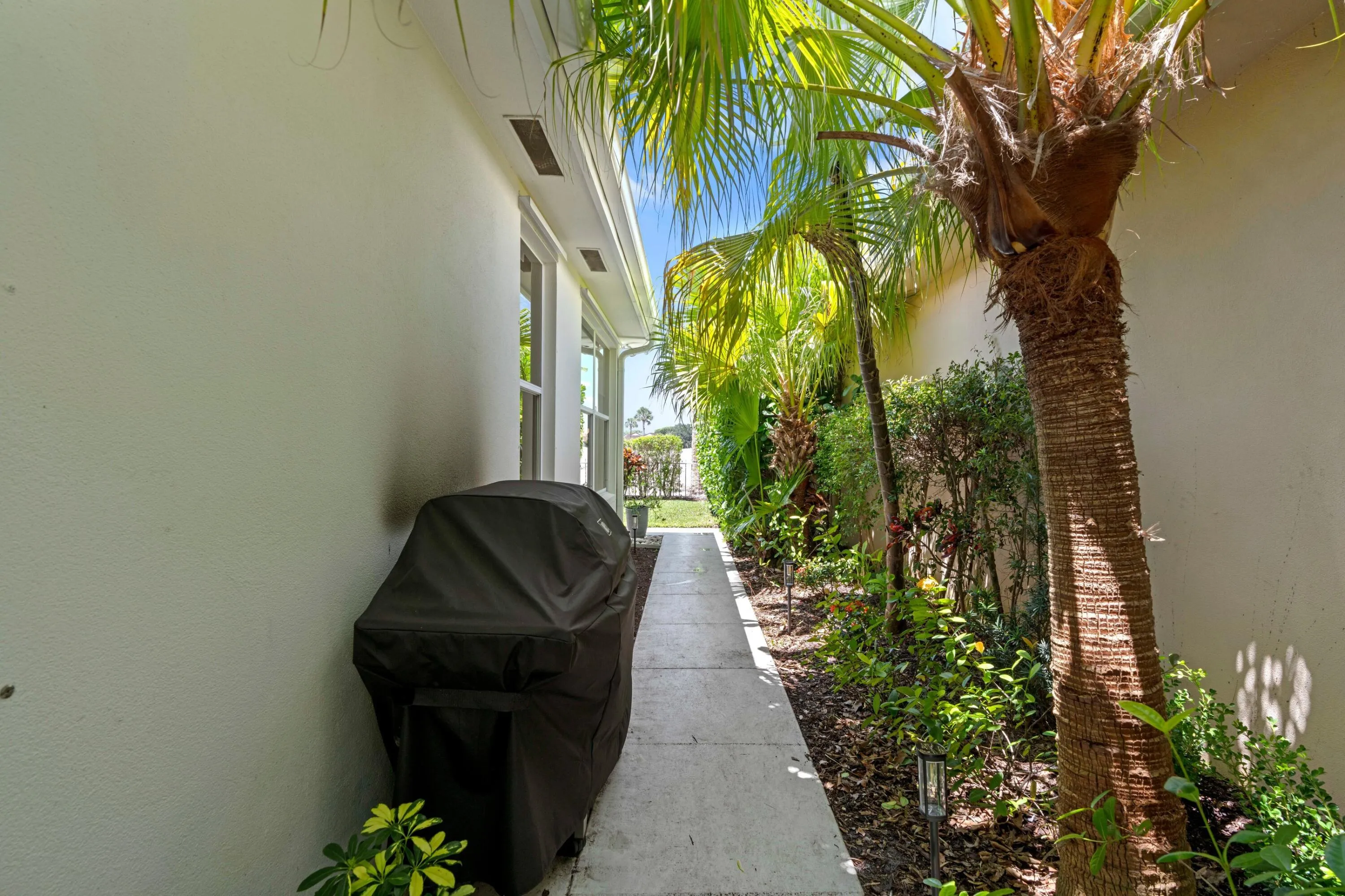Paved walkway to backyard