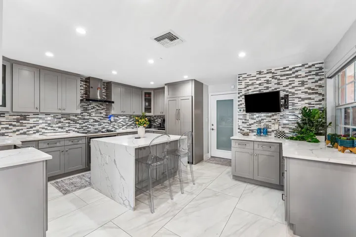 Kitchen with Waterfall Island and High-End Appliances