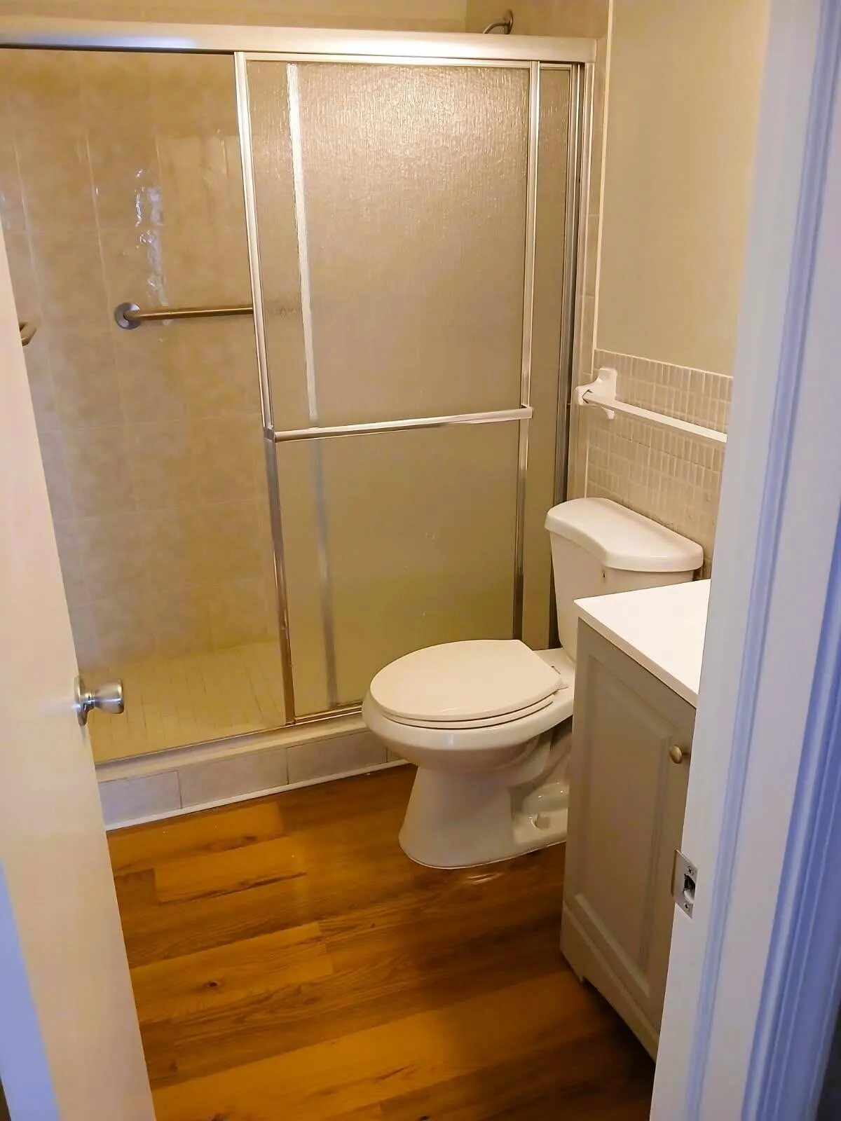 bathroom with shower,other bath has full tub.