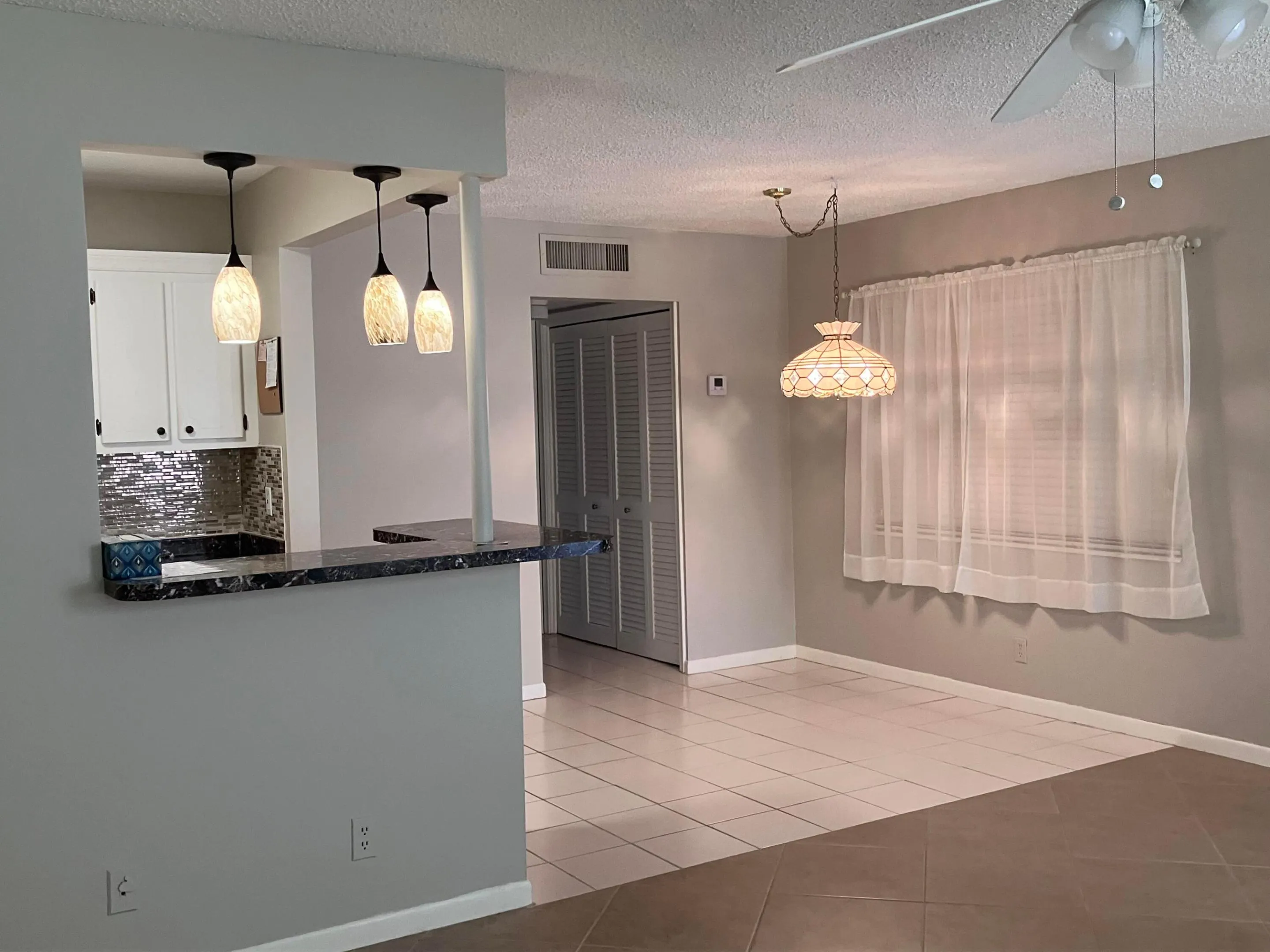 living room view to kitchen dining area