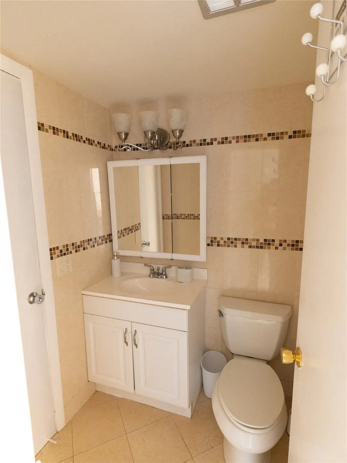 Half bathroom on your left once you enter the home.