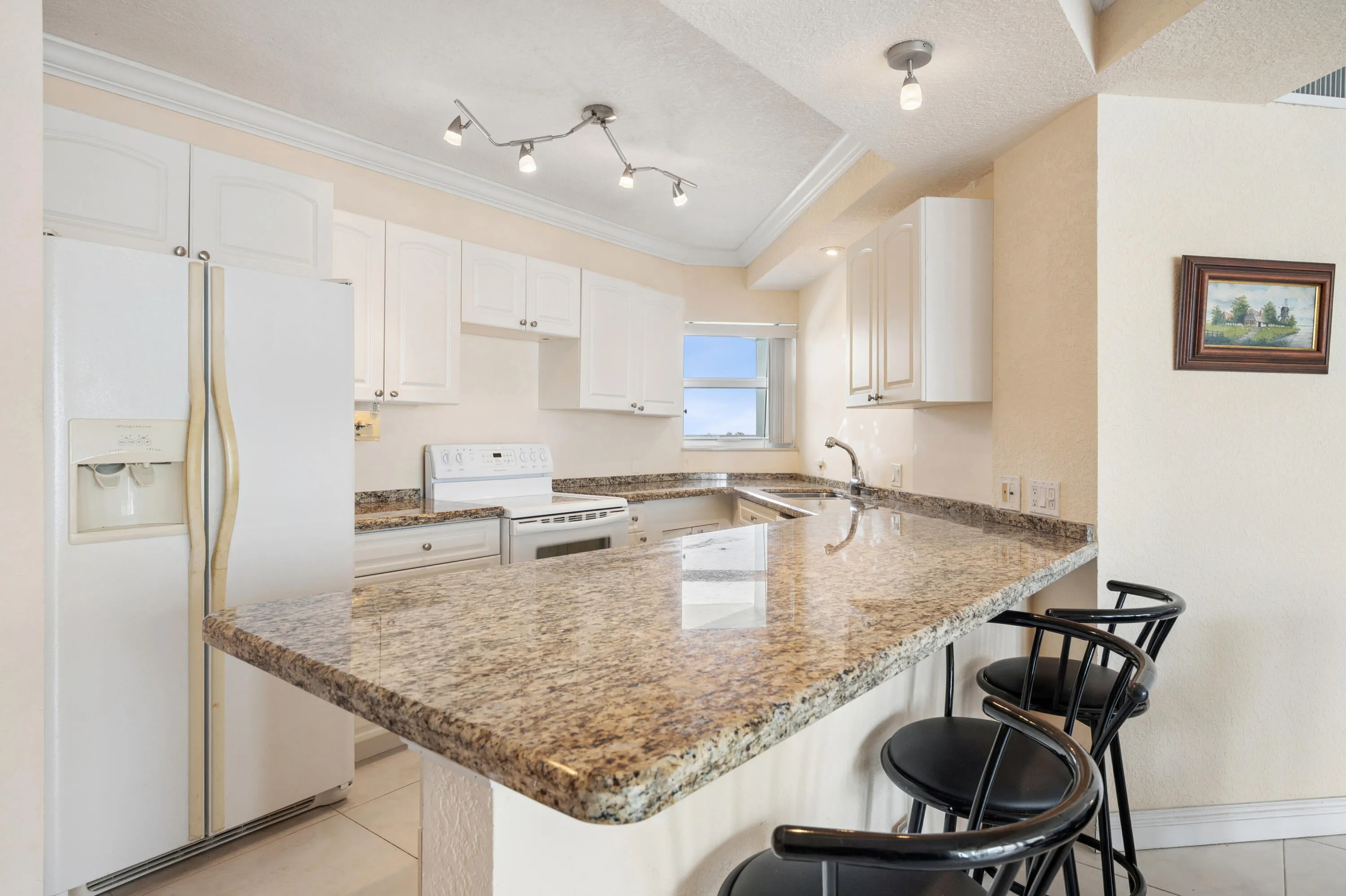Open kitchen layout allows for maximum views of Lake Mayan and the ocean.