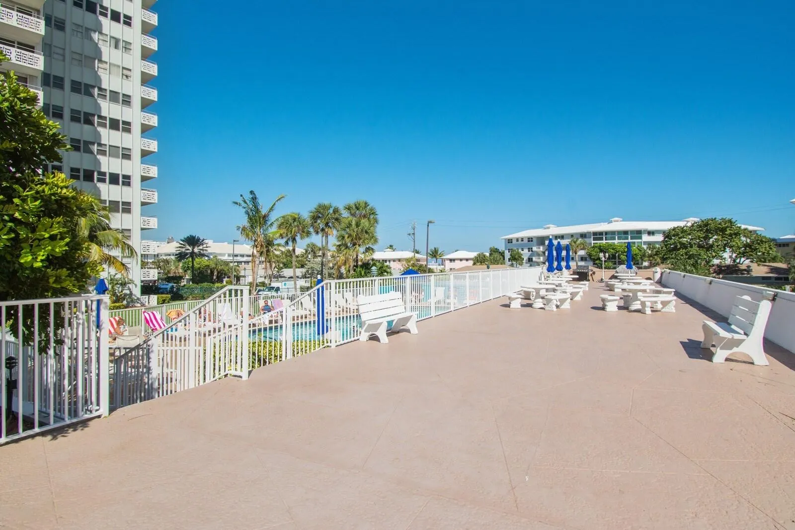 Pool deck equipped with BBQ perfect for entertaining guests and hosting.