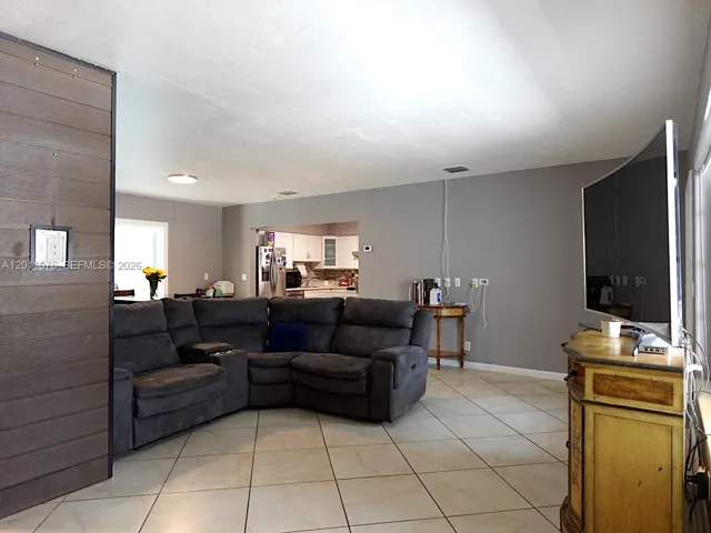 Open and inviting living space with natural light and seamless flow