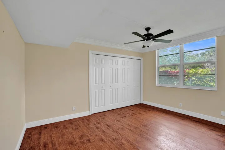 Second bedroom with side yard view.